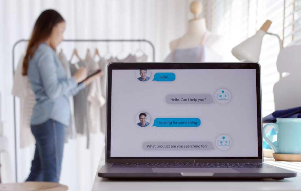 Chatbot conversation on laptop screen app interface with artificial intelligence technology